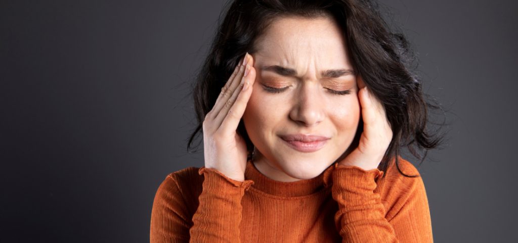 A woman suffering from a headache