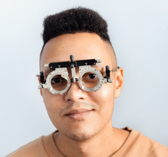 A man with an eye exam tool.